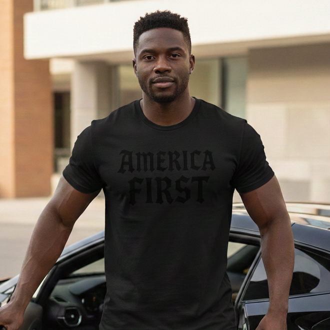 Man wearing a black t-shirt with 'AMERICA FIRST' text, standing next to a black sports car.