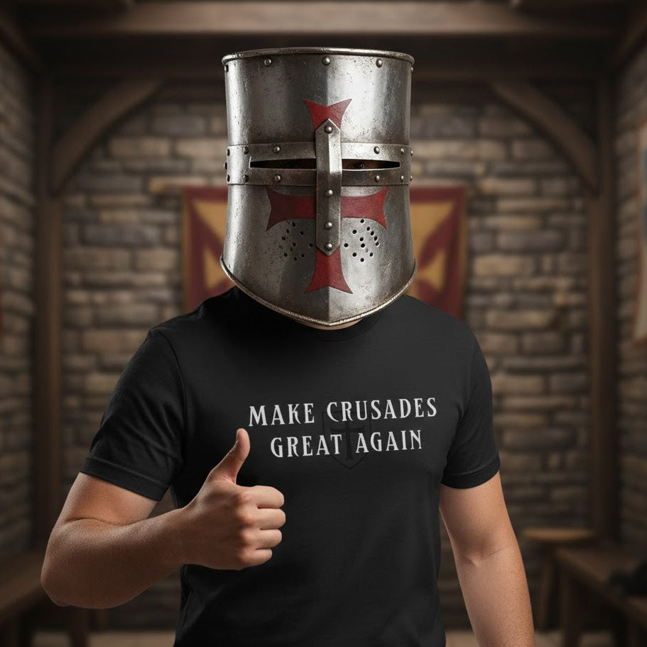Person wearing a medieval helmet and 'Make Crusades Great Again' t-shirt in a stone room.