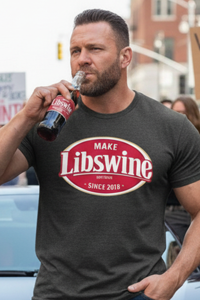 Man in 'Make Libswine' shirt drinking from a bottle in front of a car with protesters in the background.
